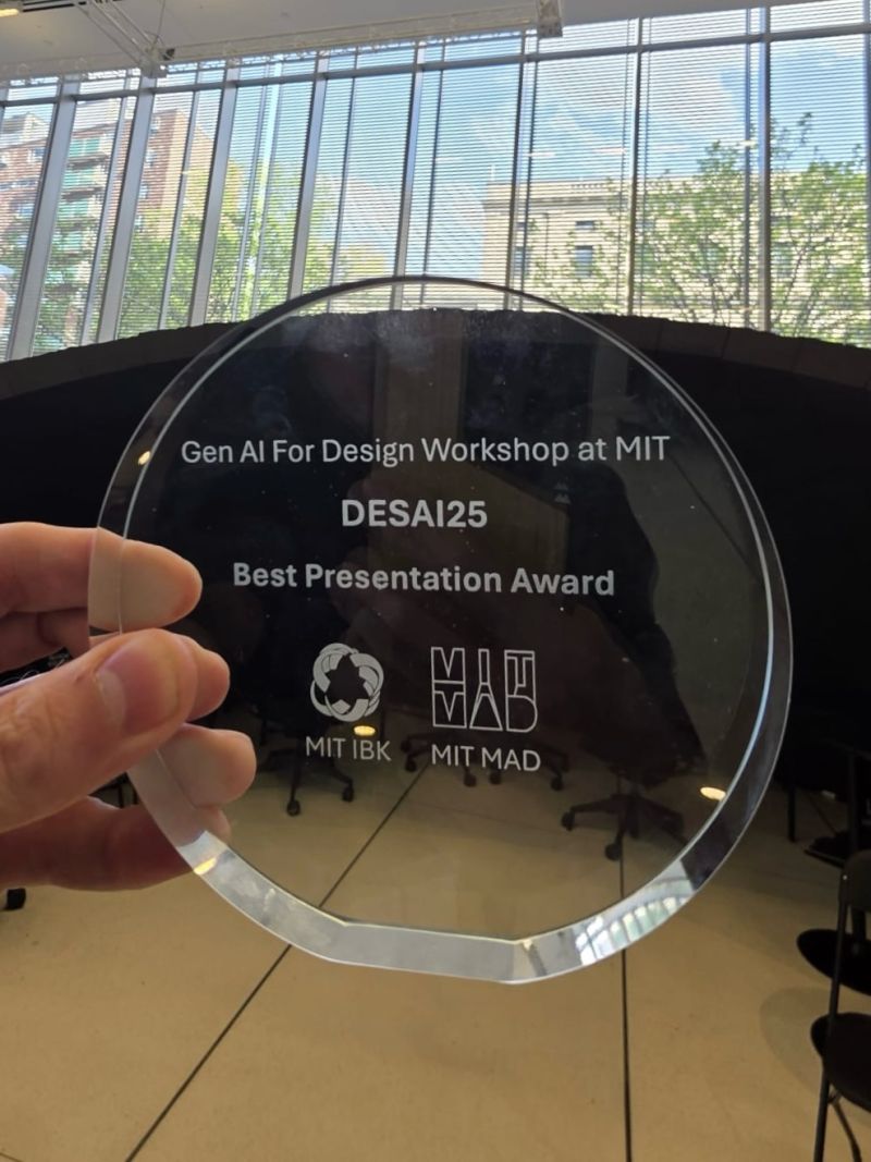 Close-up of the Best Presentation Award, engraved Gen AI For Design Workshop at MIT, DESAI25, Best Presentation Award, with MIT IBK and MIT MAD logos